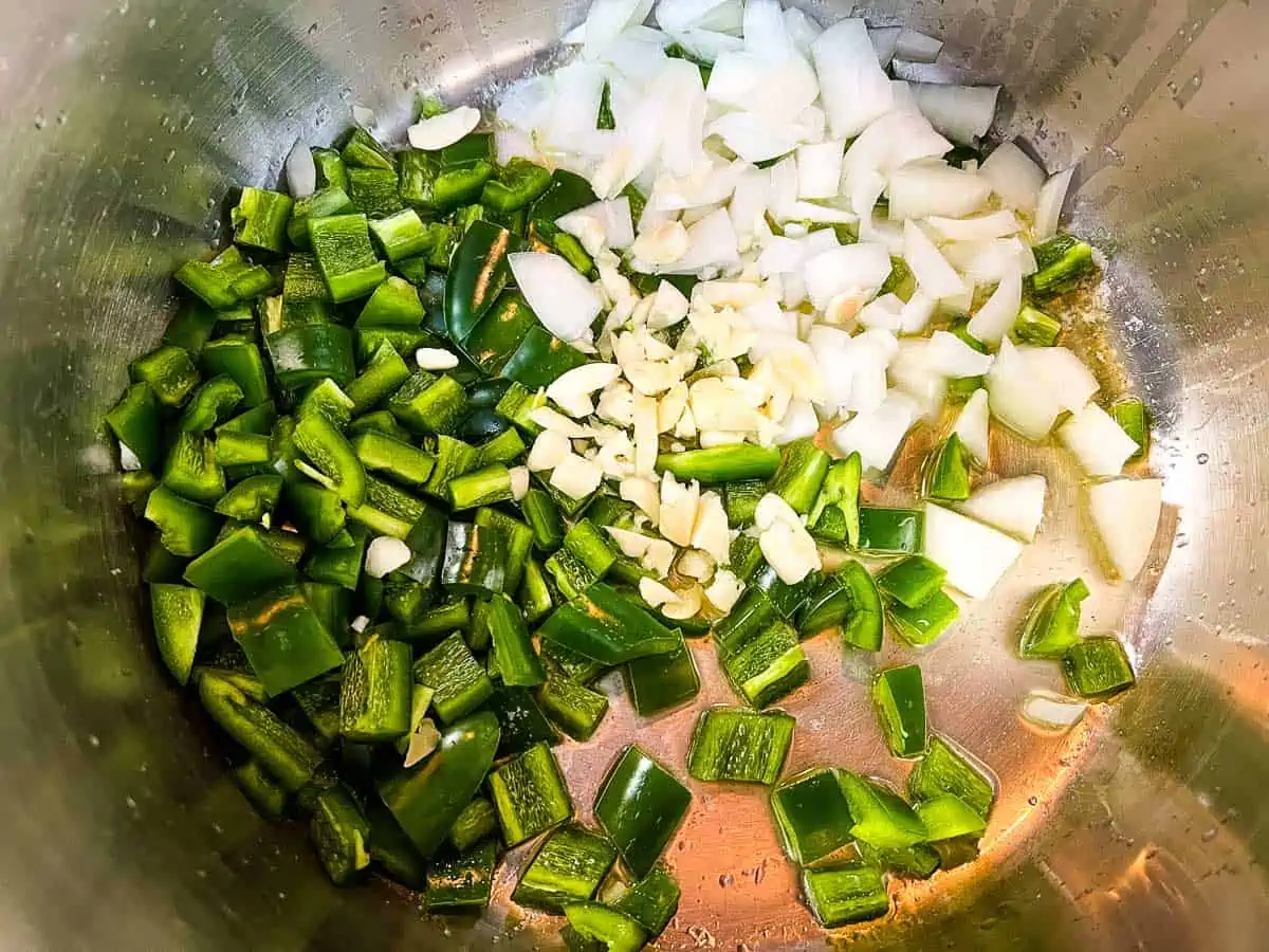 Sauteing the onions and jalapenos in the butter.