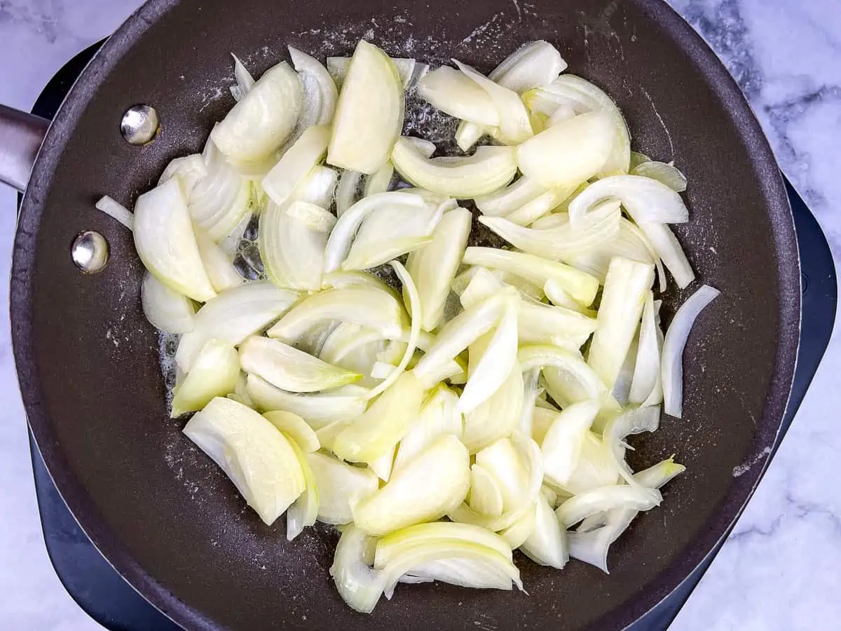 Cooking the onions in butter.