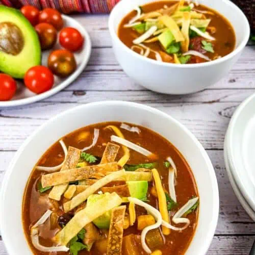 Two bowls of Turkey tortilla soup.