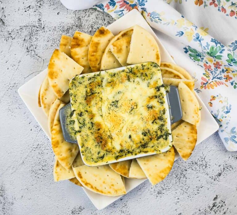 A top-down shot of Spinach and Brie Dip in a serving dish.