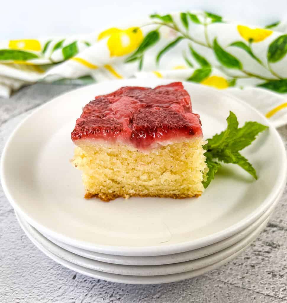 A slice of strawberry cake on a plate.