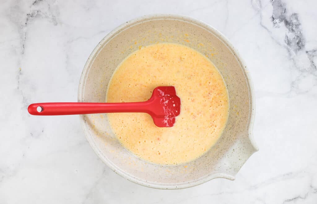 Mixed wet ingredients in a bowl.