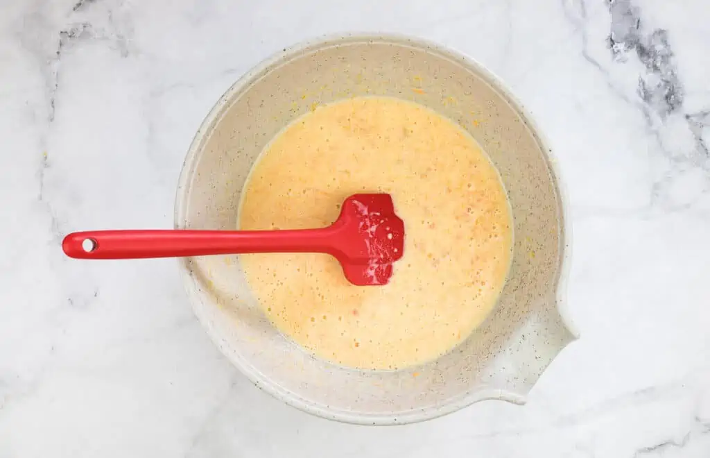 Mixed wet ingredients in a bowl.