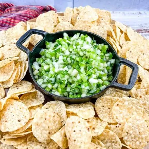 Tomatillo Pico de Gallo on a plate with tortilla chips.
