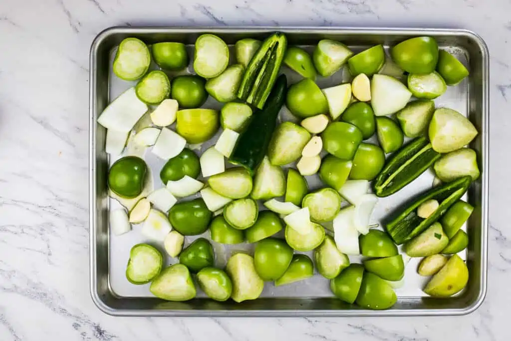 Veggies on a sheet pan ready for roasting.