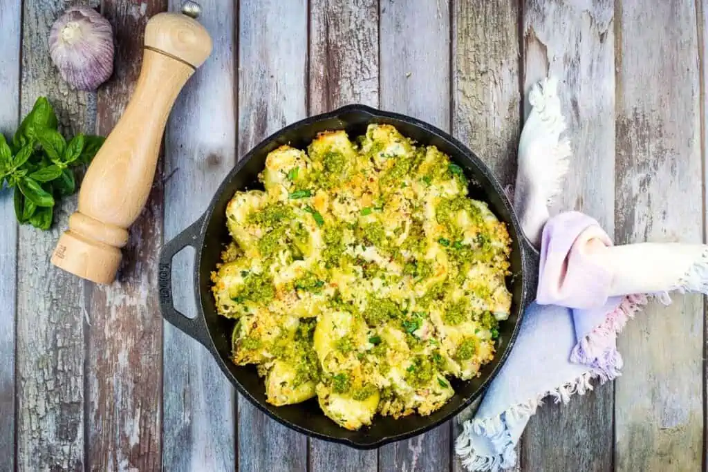 Turkey Stuffed Shells with Pesto in a black serving dish.