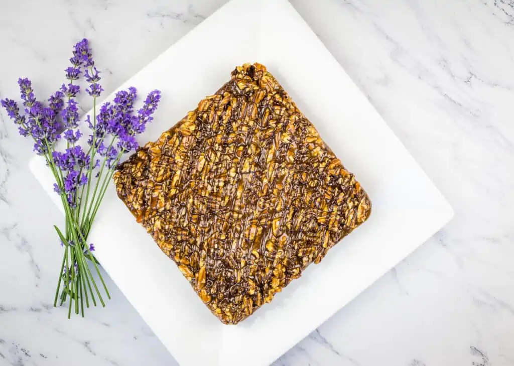 Top down image of Turtle Brownies on a white plate.