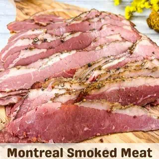 Sliced Montreal Smoked Meat on a cutting board.