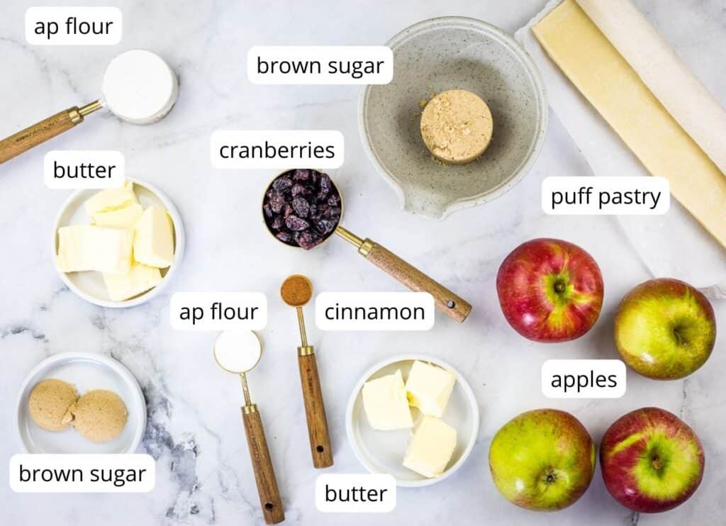 Labeled ingredients to make apple-cranberry puff pastry tarts.