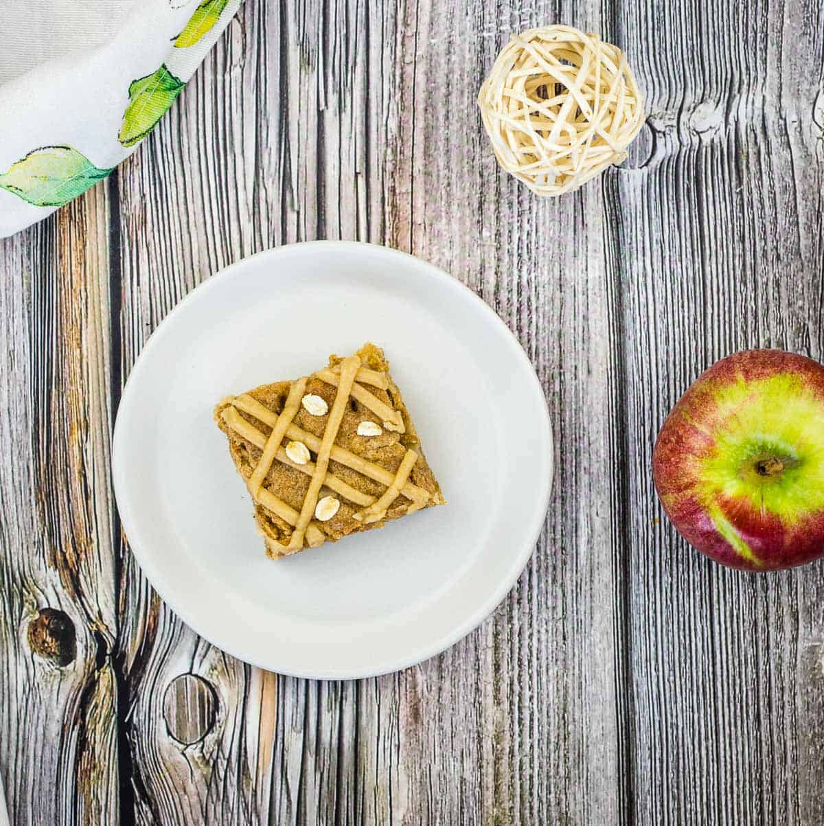 A top-down shot of a Brown Butter Apple Blondie on a plate.