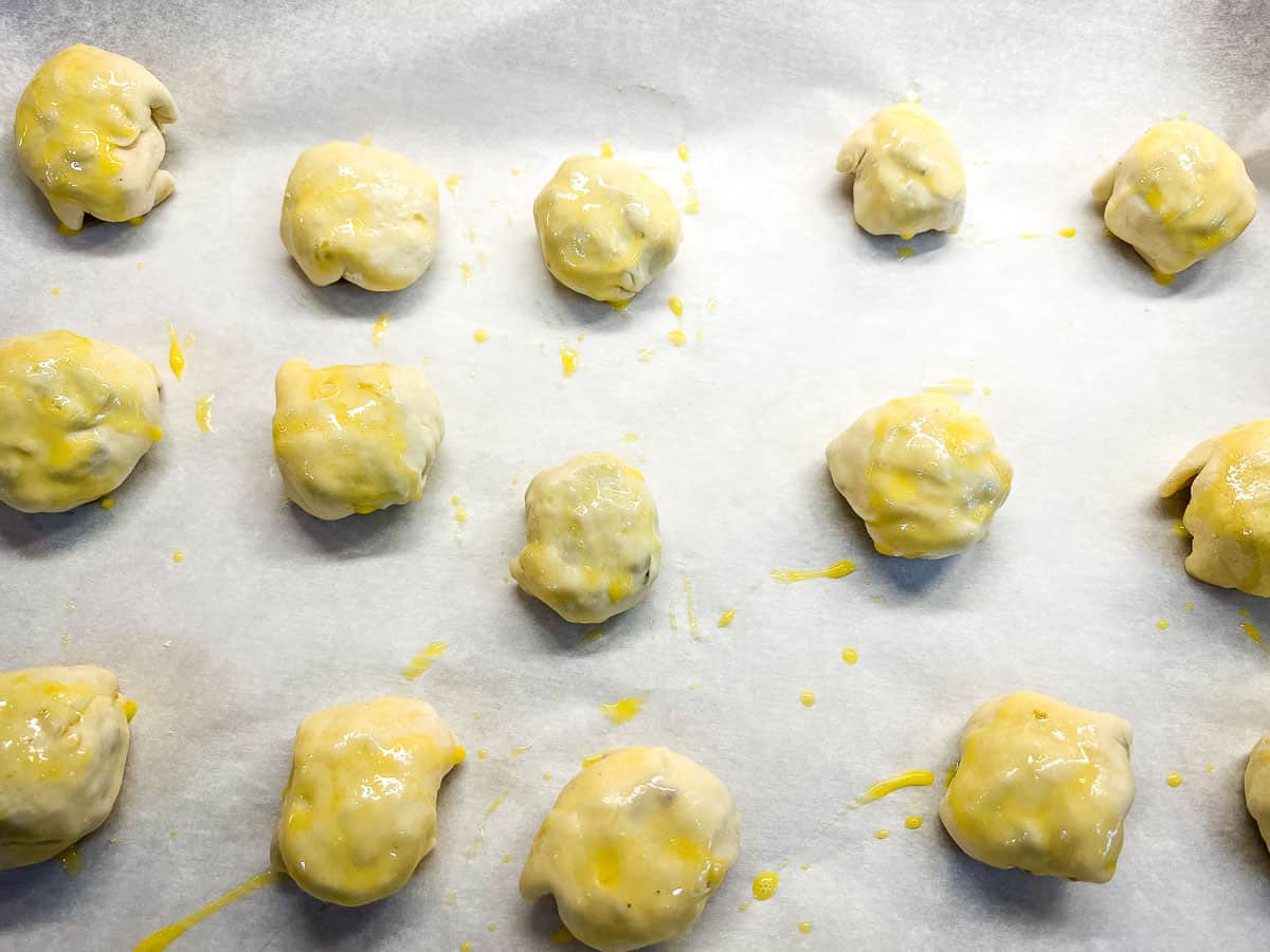 A pan of Beef Wellington Bites brushed with egg wash.