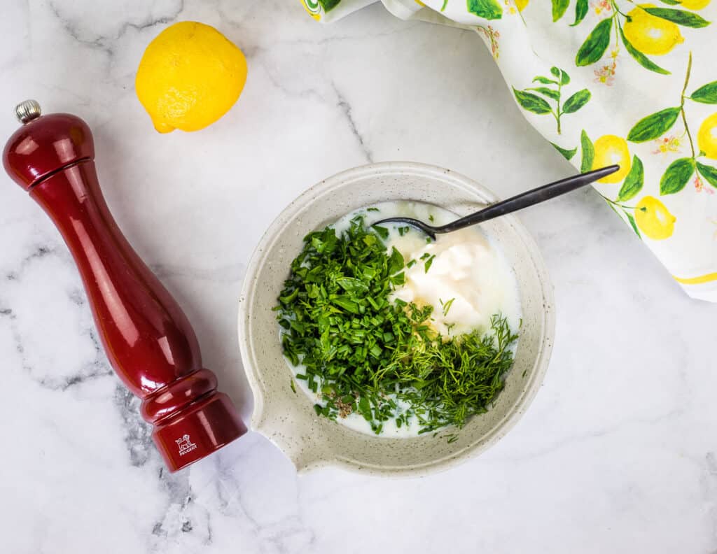 Chopped herbs added to buttermilk and mayo.