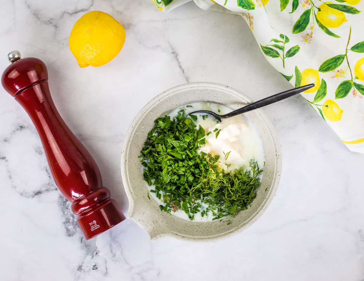 Chopped herbs added to buttermilk and mayo.