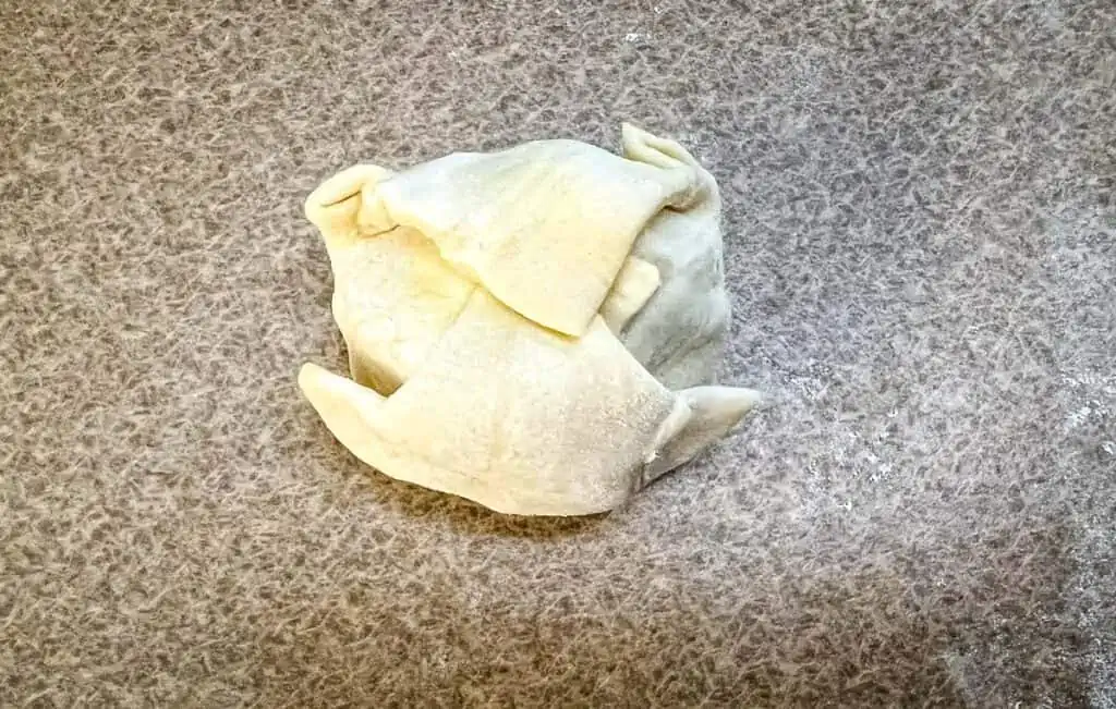 A sealed Beef Wellington Puff Pastry bite.