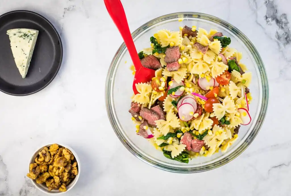 Toss the pasta and ingredients.