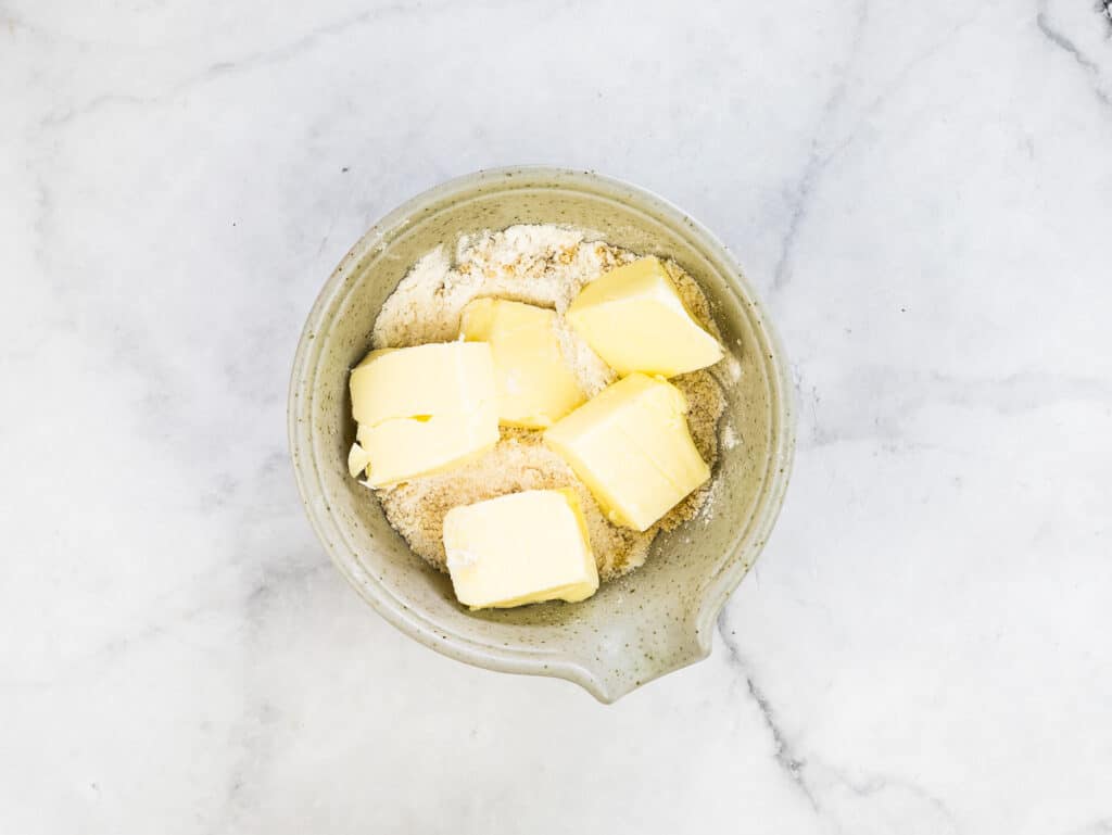 Butter, sugar and flour in a small bowl to make the crumble.
