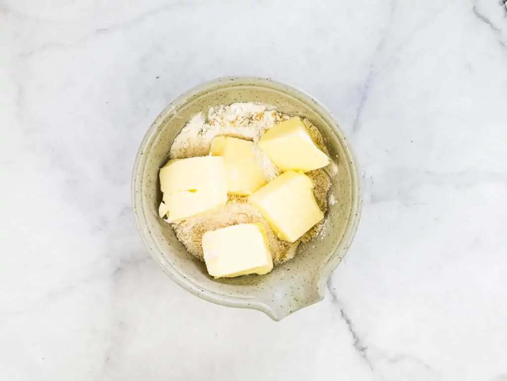 Butter, sugar and flour in a small bowl to make the crumble.