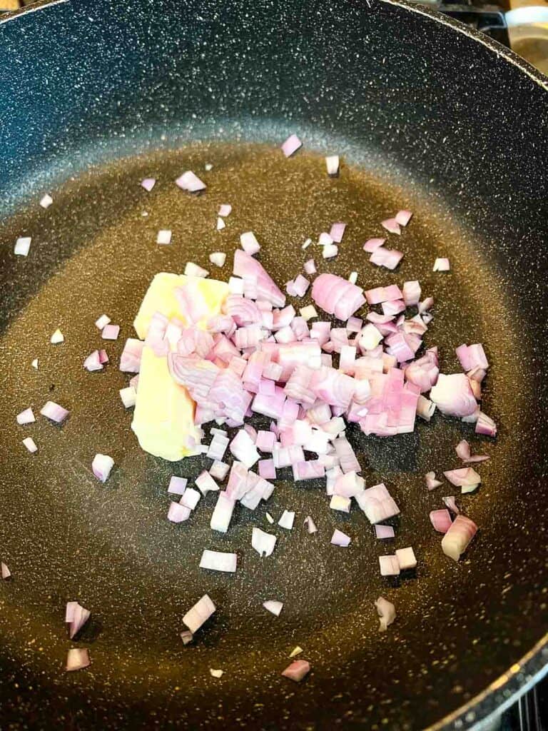 Sauting the shallots in butter.
