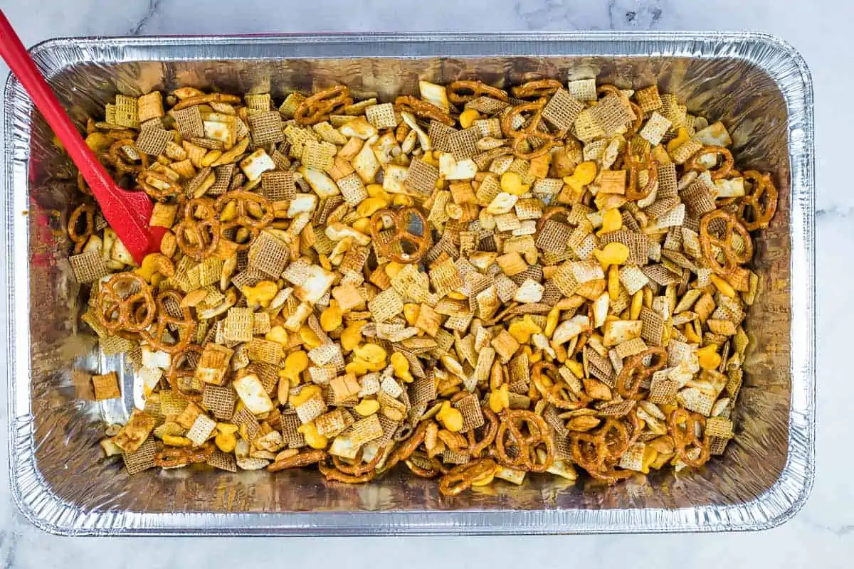 Chex mix tossed with butter mixture.