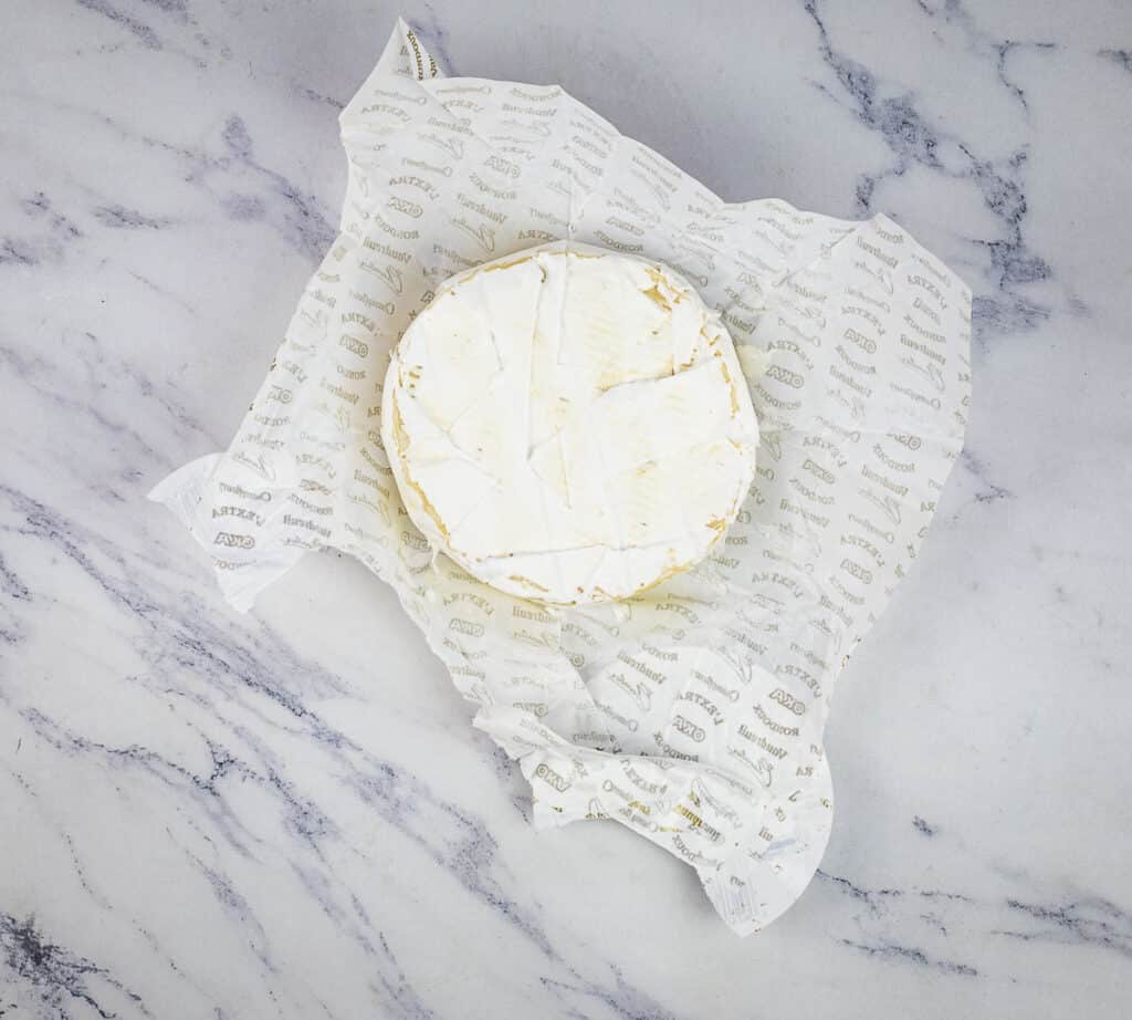 Brie sitting on the wrapper.