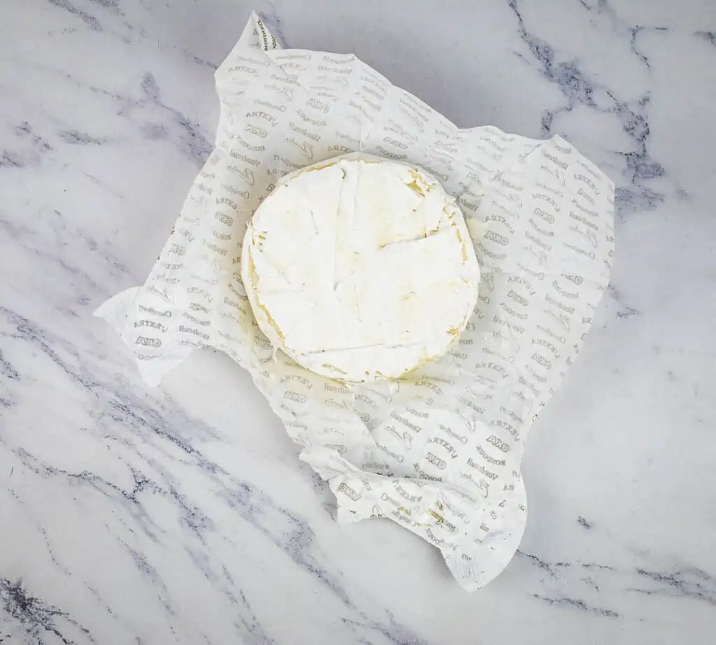 Brie sitting on the wrapper.