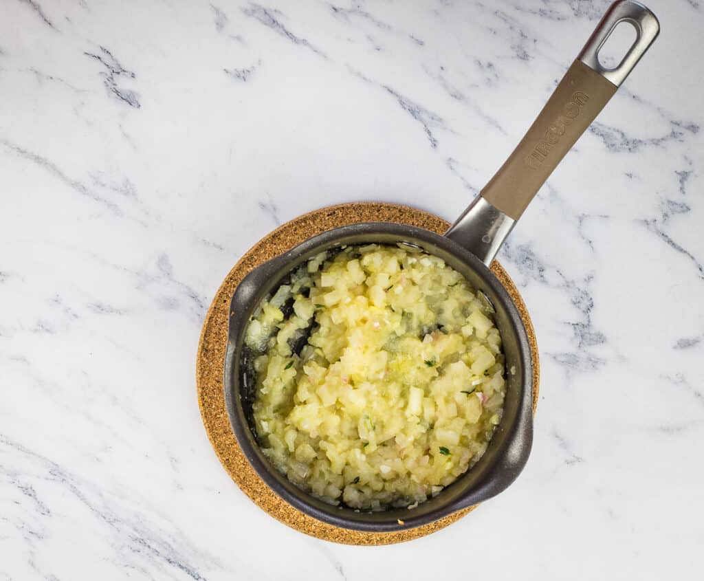 Cooked apple ginger chutney in a pan.