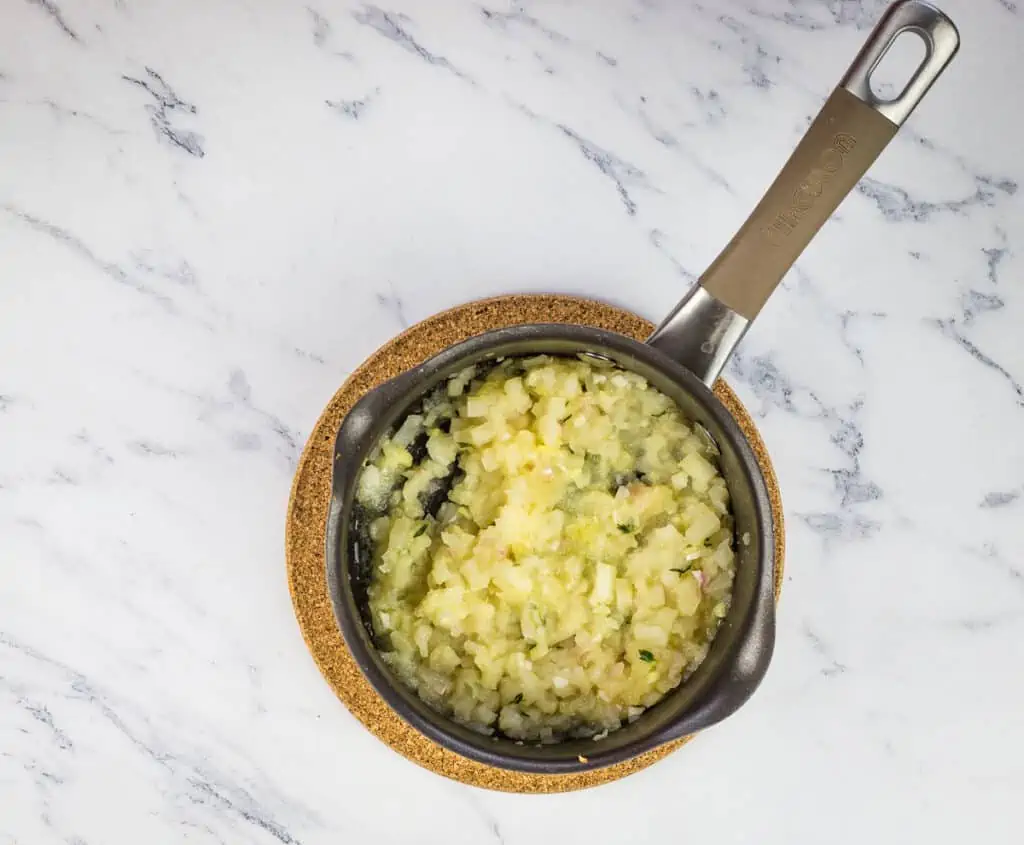 Cooked apple ginger chutney in a pan.