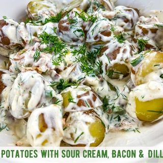 Potatoes with Sour Cream and Bacon in a serving dish.