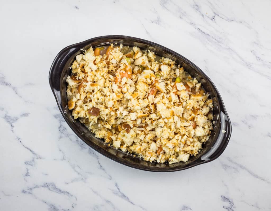 Carrots with crumb topping in a baking dish.