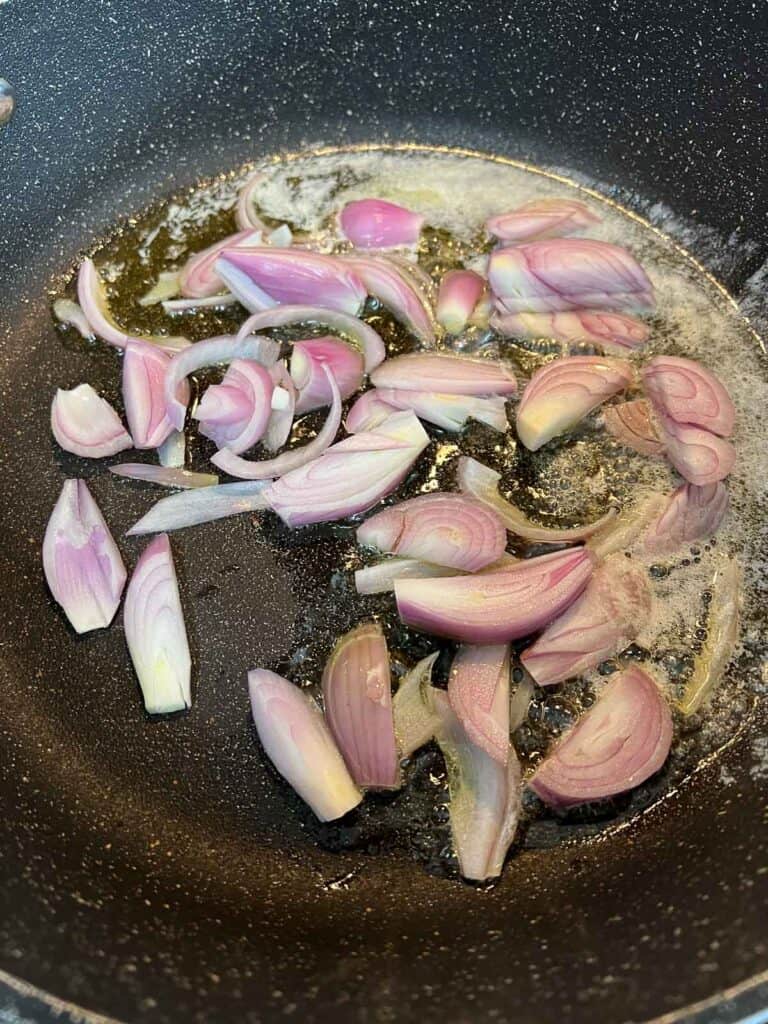 Sauteeing the shallots in butter and oil.