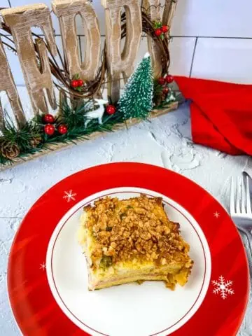 A slice of Christmas Morning Casserole on a festive plate.