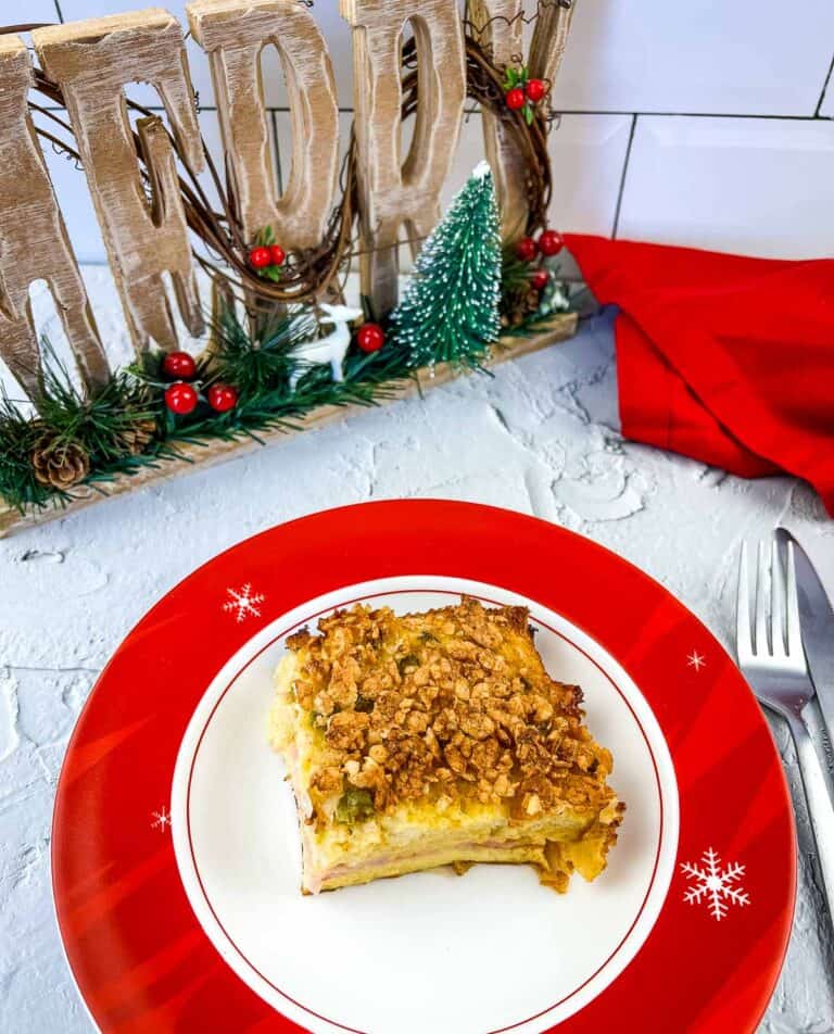 A slice of Christmas Morning Casserole on a festive plate.