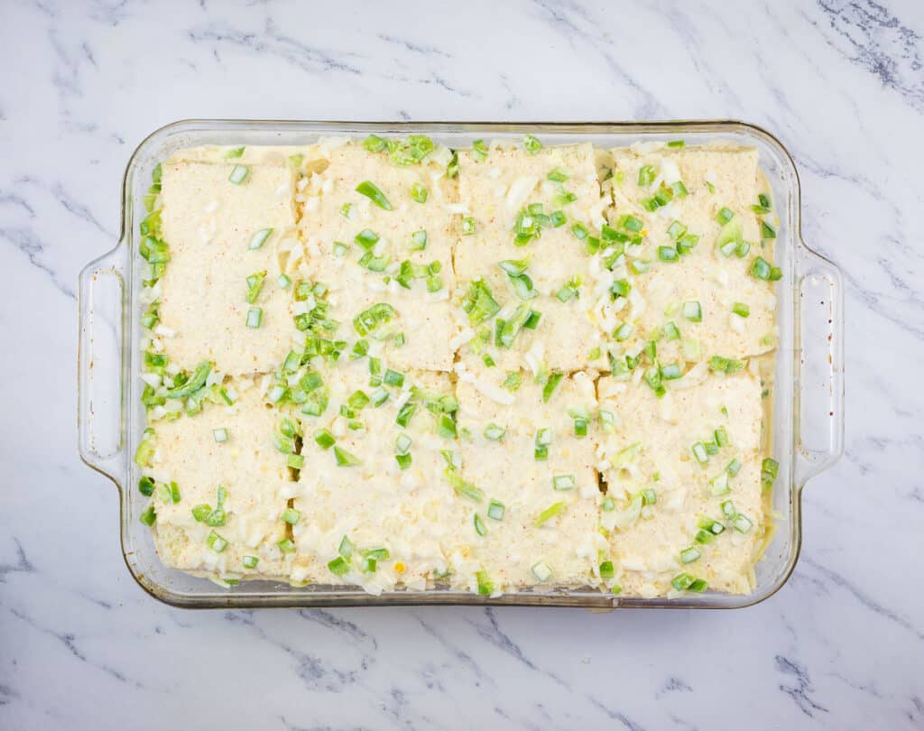 Egg custard poured over the top of the casserole.