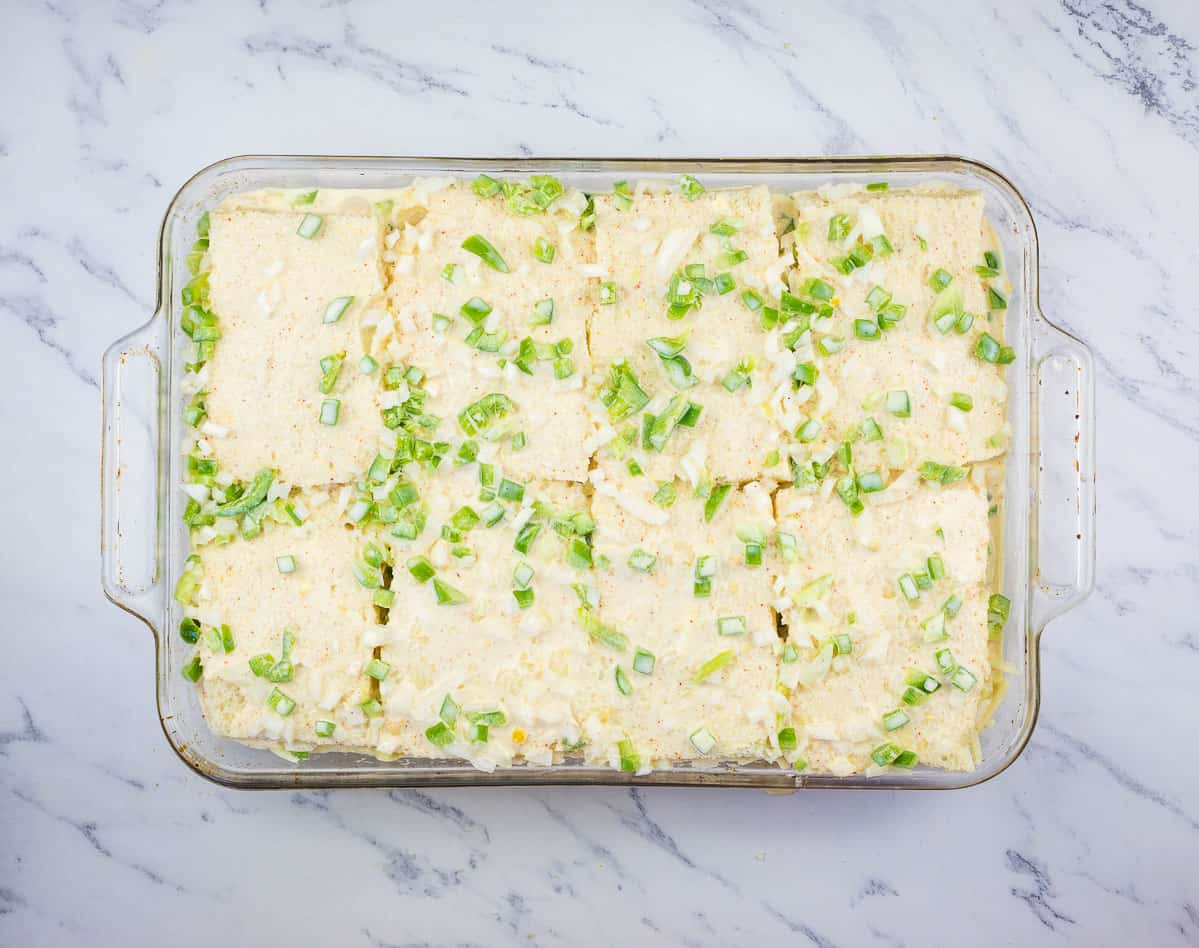 Egg custard poured over the top of the casserole.