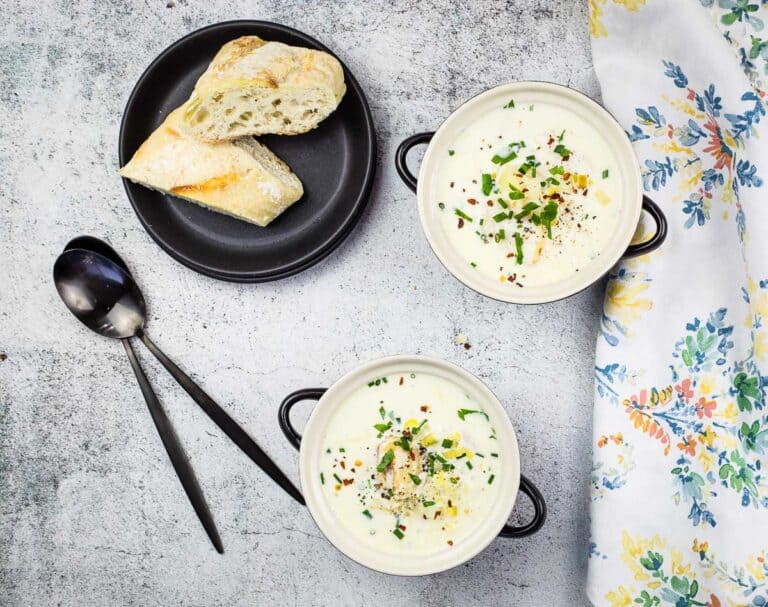 A top-down shot of 2 bowls of cullen skink.