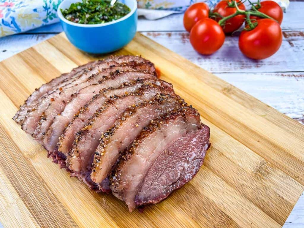 Sliced picanha roast on a cutting board.