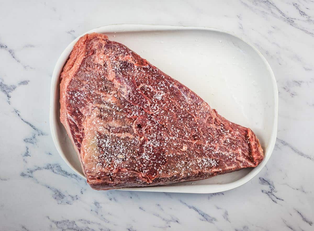 Picanha roast with the underside liberally salted.