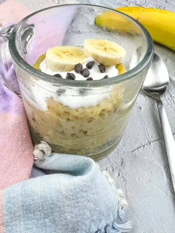 Banana Chocolate Chip Mug Cake with bananas and chips on top.