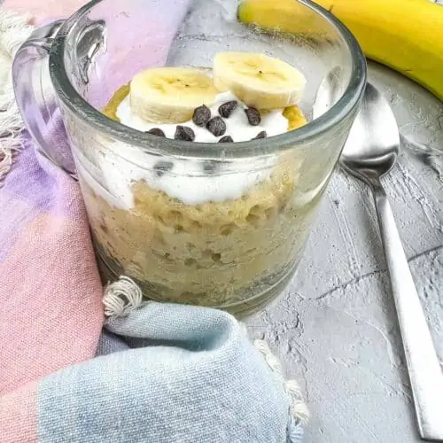 Banana Chocolate Chip Mug Cake with bananas and chips on top.