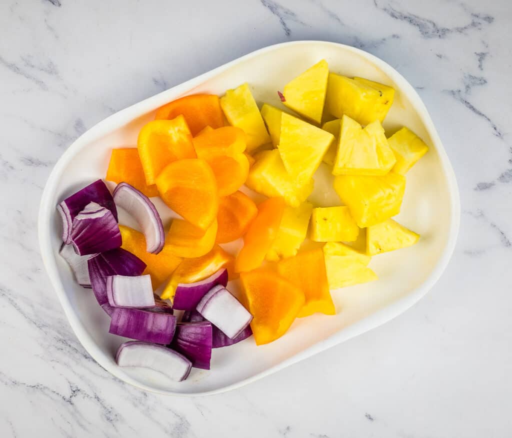 Cut fruit and veggies to make the kabobs.