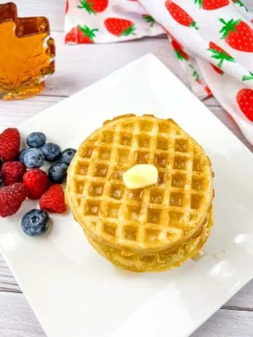 A stack of waffles heated up in the air fryer.