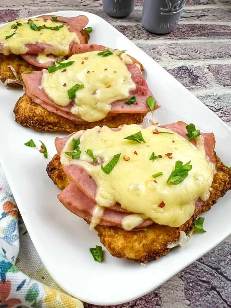 Lazy air fryer chicken cordon bleu on a white plate.