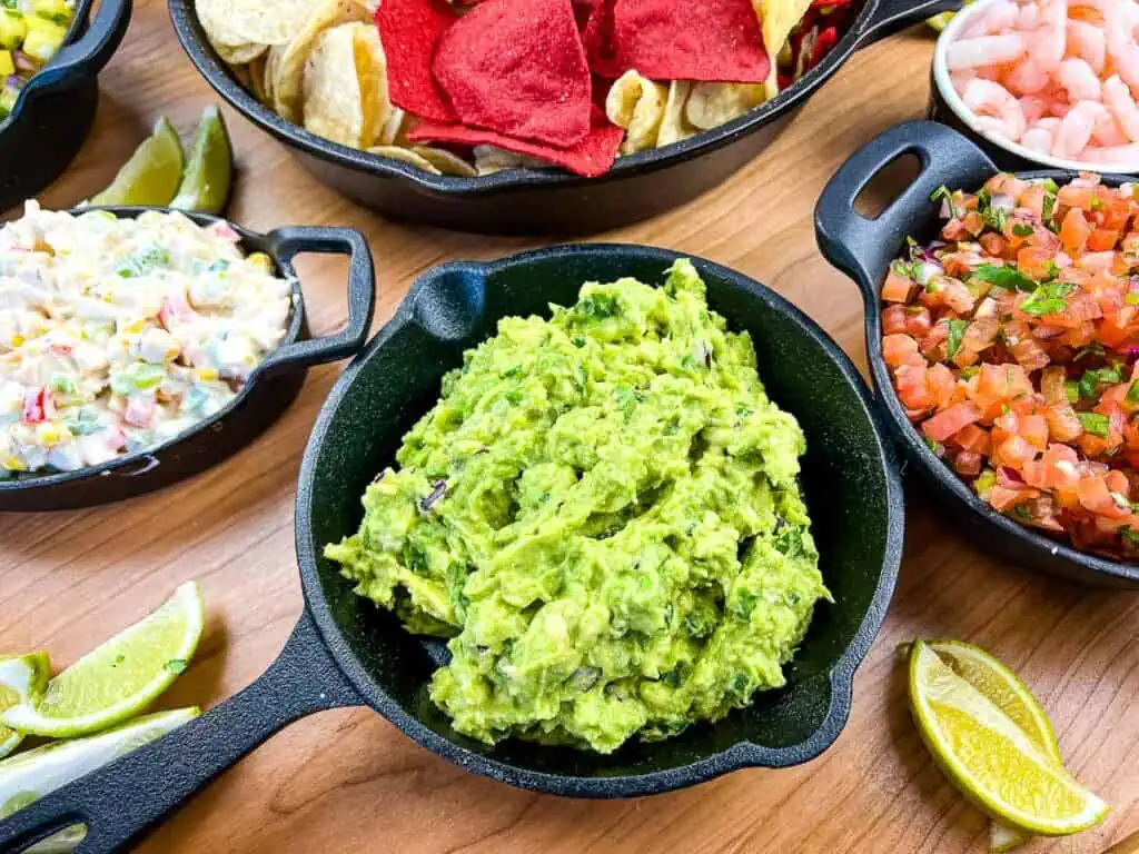 A closeup shot of guacamole on a guacamole snack board.