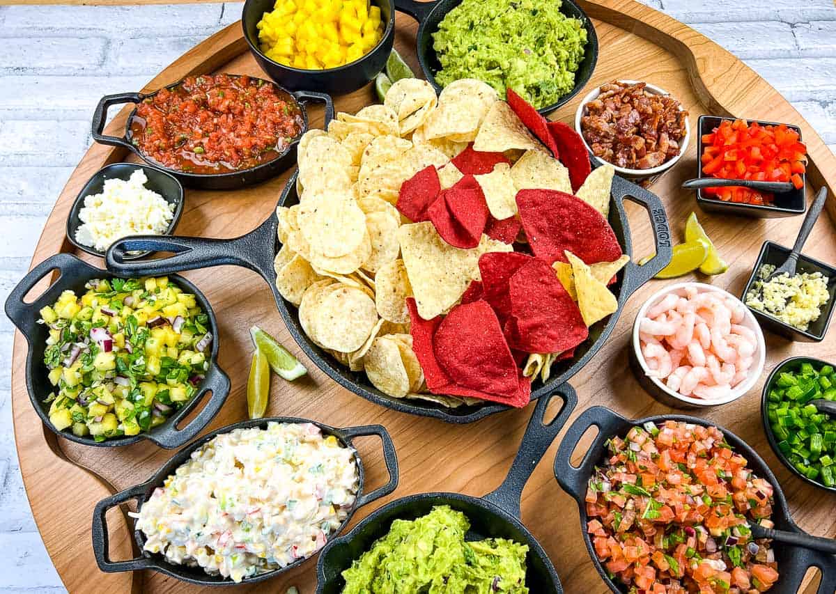 A top-down shot of a guacamole snack board.