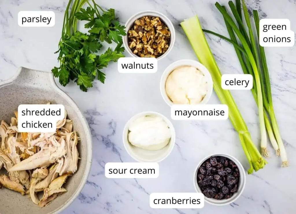 Labeled ingredients to make Chicken Cranberry Walnut Salad
