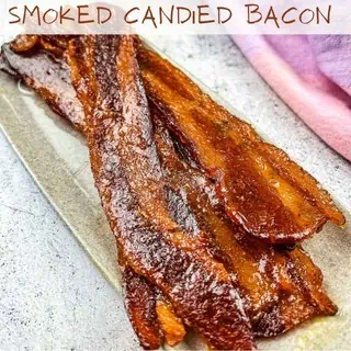 Smoked candied bacon on a plate.