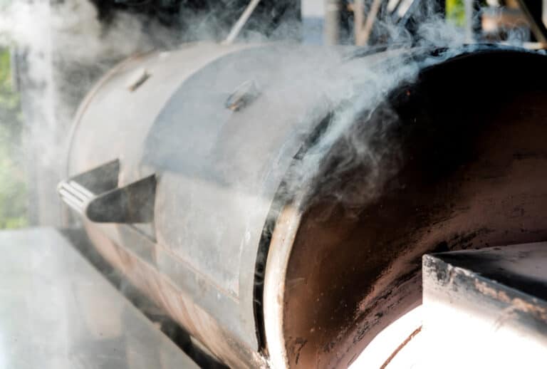 A smoker with smoke coming out of it.
