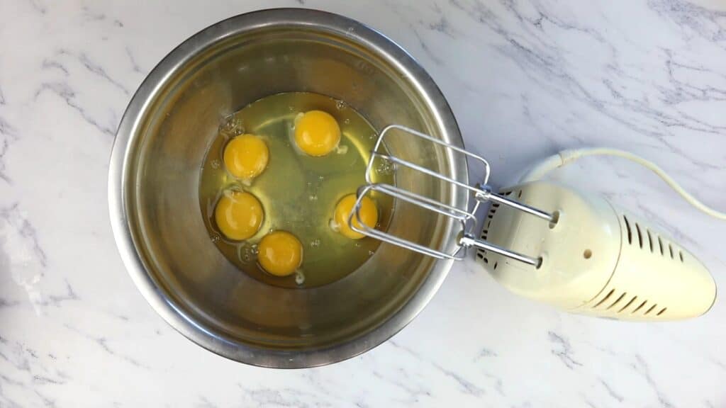 Eggs in a bowl ready to be whipped.