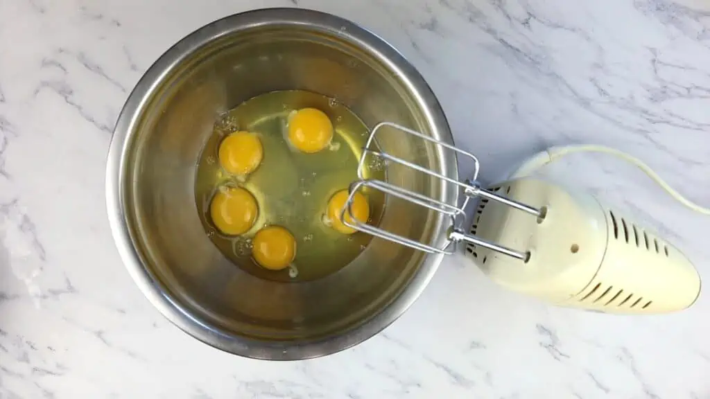 Eggs in a bowl ready to be whipped.