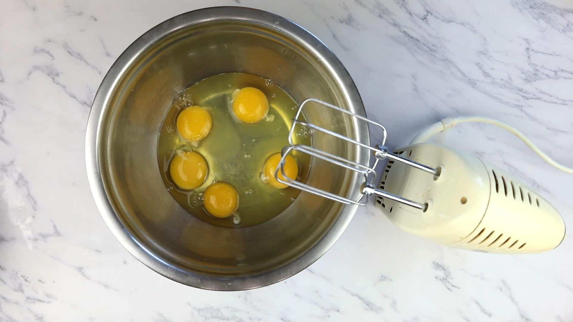 Eggs in a bowl ready to be whipped.